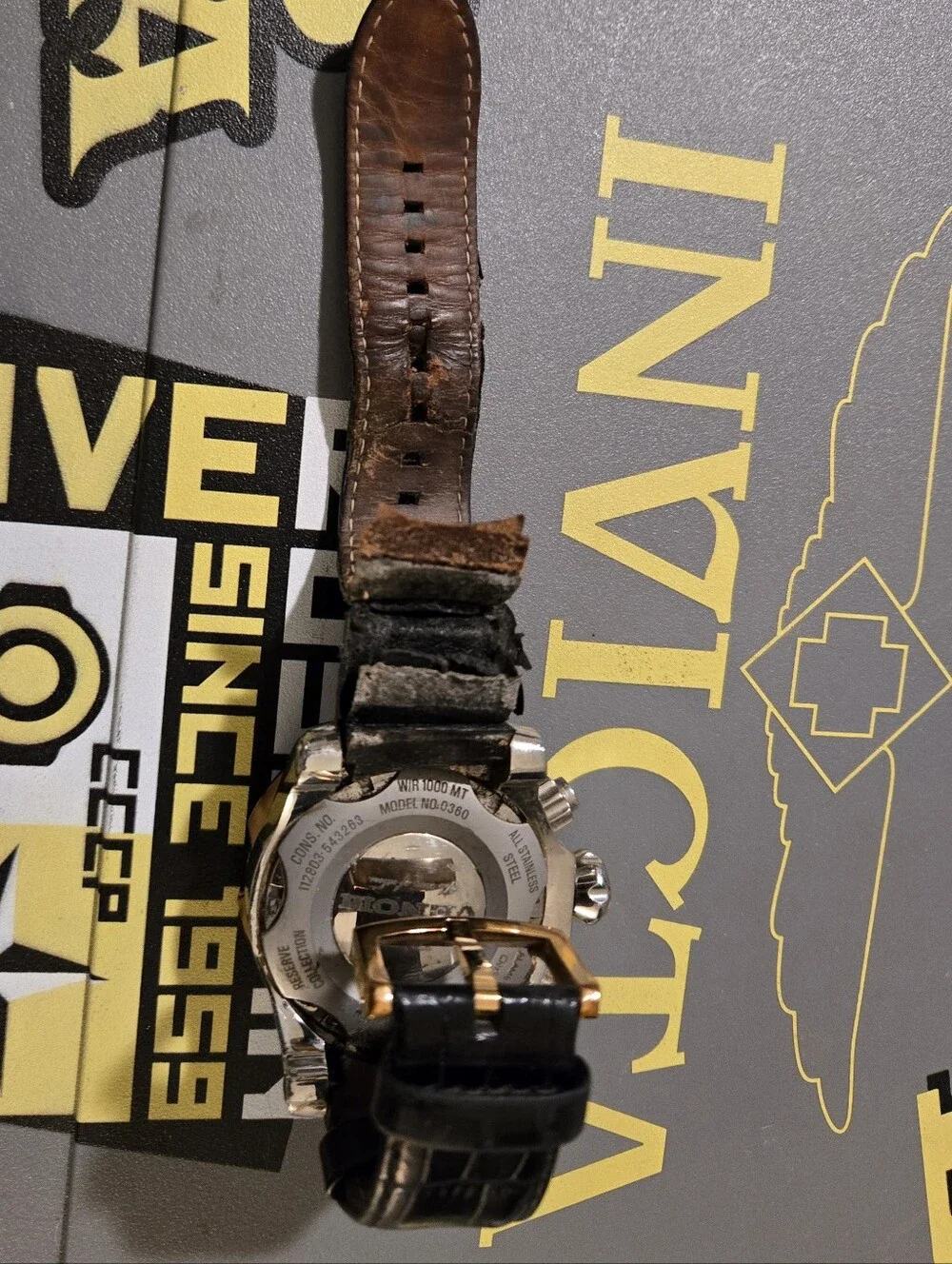 Invicta Gold and Black Chronograph Watch with Black Leather Strap. Needs Strsp